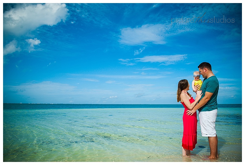 family on beach cayman islands