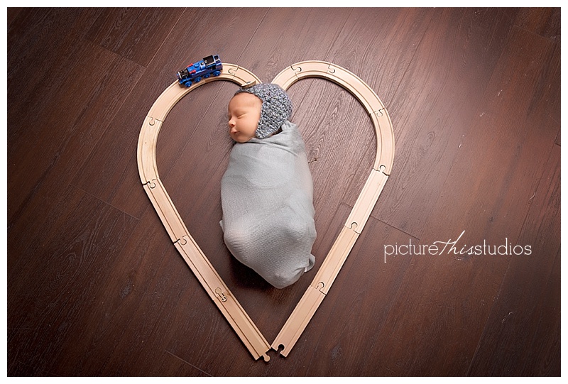 newborn with heart train tracks