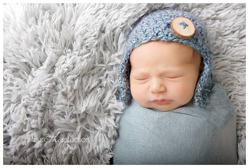 swaddled baby in studio photography