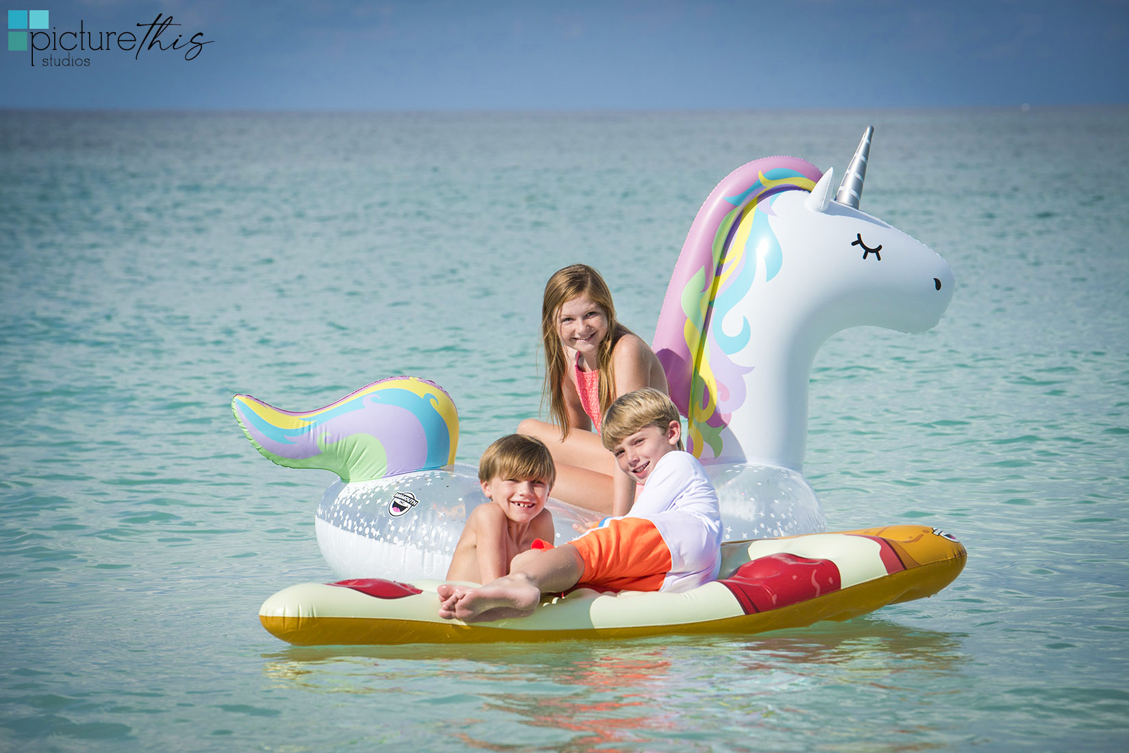 After the “serious” portraits are done it is so fun to get some action shots and take a dip in that beautiful blue sea.