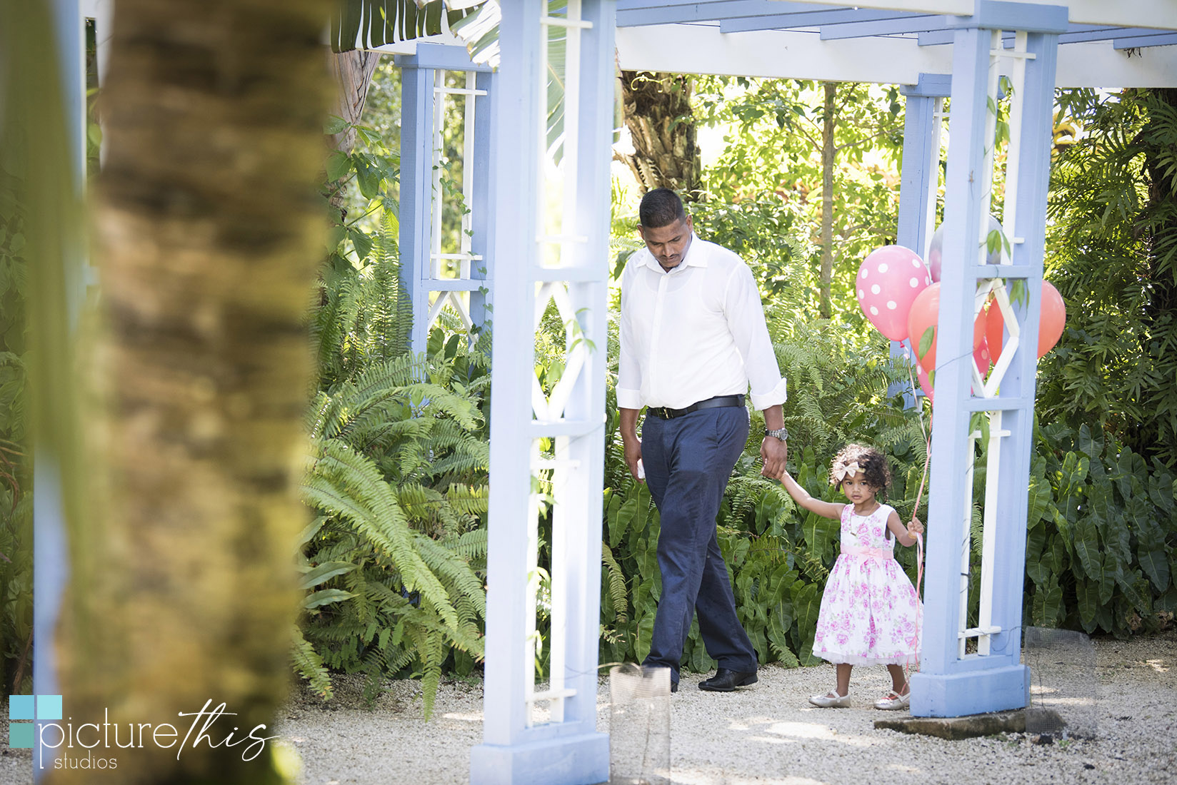 This beautiful little two year old celebrated with family portraits at The Cayman Islands Botanical Park by Heather Holt Photography with Picture This Studios